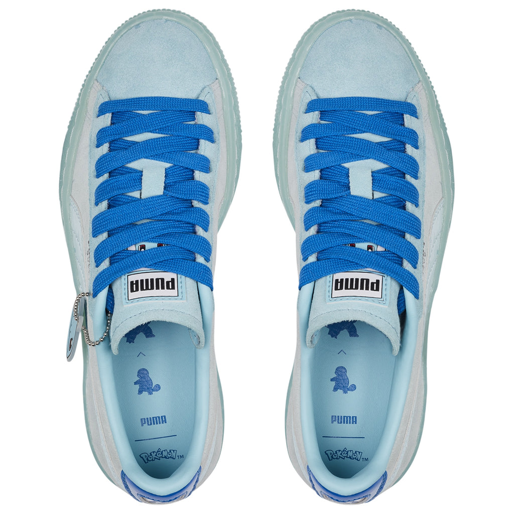 Puma Light blue sneakers with blue laces on a white background