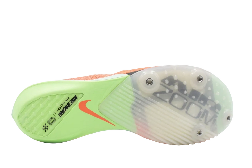 Underneath view of Nike Victory 2 track spikes showing the carbon Flyplate and 4-spike traction.
