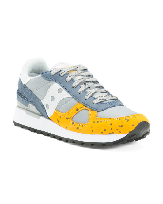 Saucony Shadow S70518-1 Sneaker with yellow and blue design on a white background