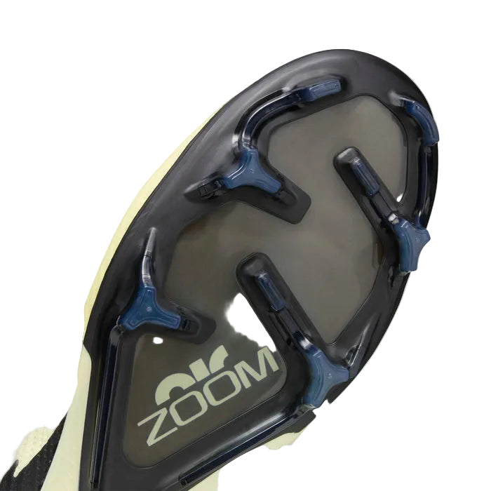 Soleplate view of the Vapor 15 Elite FG showing tri-star studs and the Zoom Air window.
