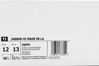 A white shoebox showing the back side with size information for 'JABBAR HI' in LA, including US sizes 12 and 13, height 11 1/2, and a barcode JQ8584.