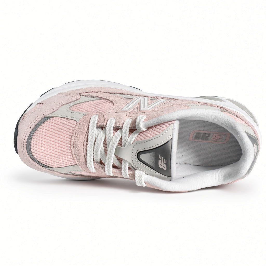 Top down view of the grade school New Balance 2010 G201038W showcasing the lace closure, mesh upper, and padded tongue branding.