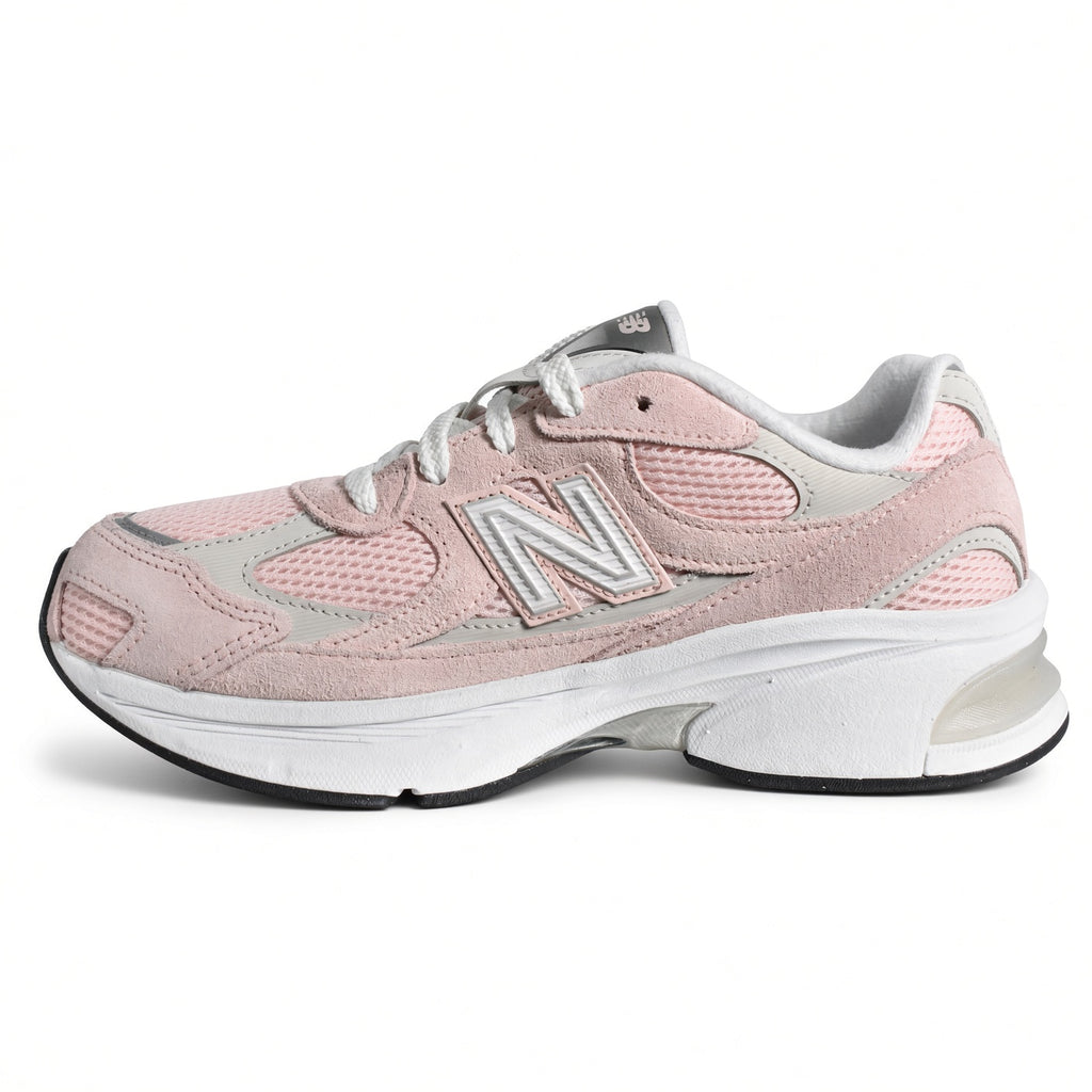 Lateral side view of the New Balance 2010 Big Kids sneaker in style code G201038W featuring a diamond mesh base and chunky ABZORB cushioned midsole.