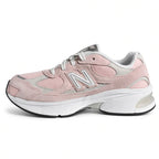 Lateral side view of the New Balance 2010 Big Kids sneaker in style code G201038W featuring a diamond mesh base and chunky ABZORB cushioned midsole.