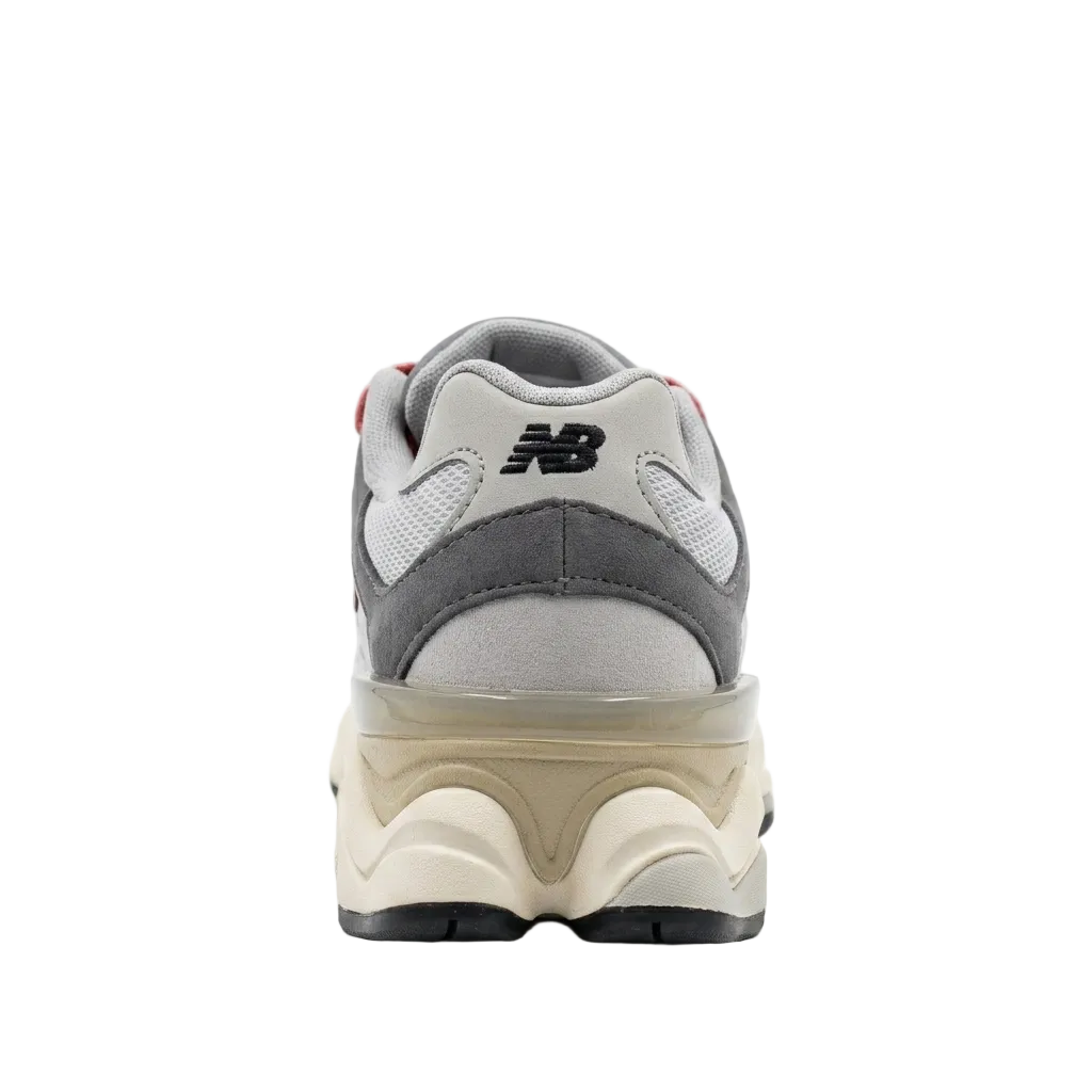 Rear heel view of the kids New Balance 9060 PS Rain Cloud sneakers highlighting the sculpted heel device and branding.