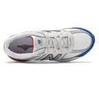 Medial inner side view of kids New Balance 990v5 premium lifestyle sneakers with reflective accents, PC990NB5.