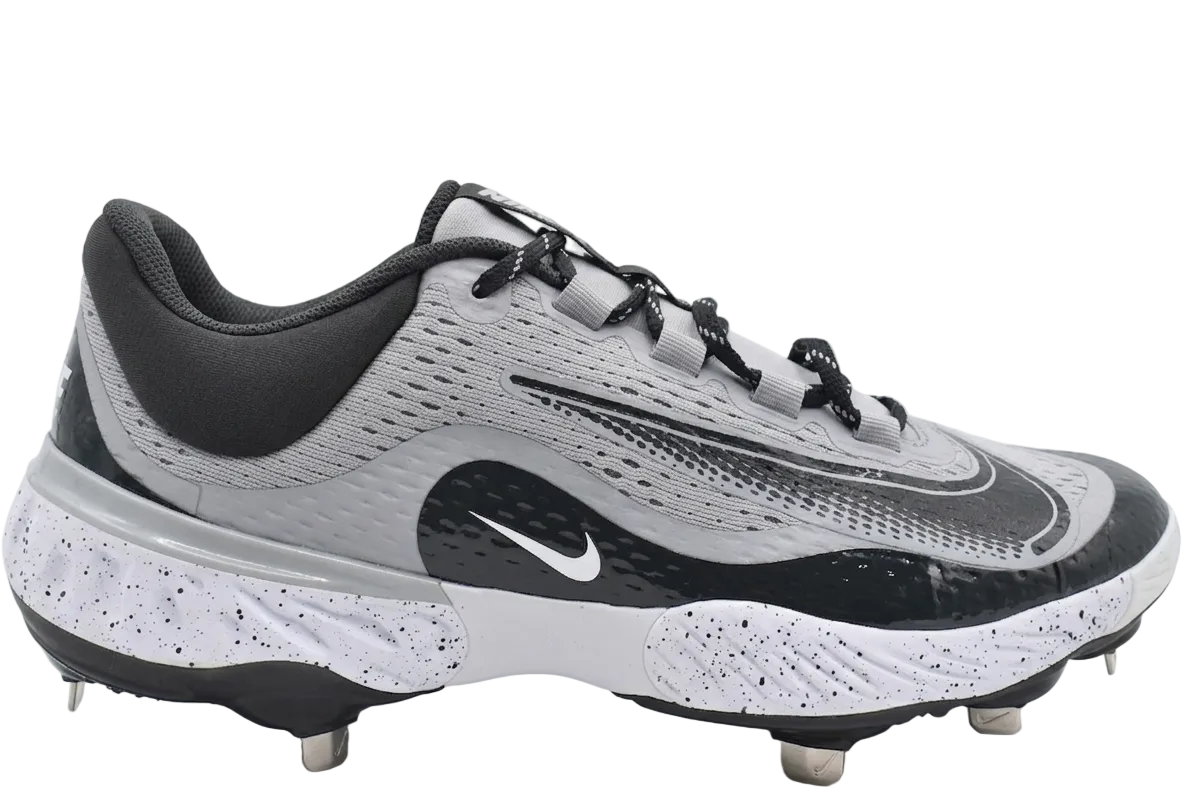 Nike Alpha Huarache Elite 4 Low Baseball Cleats in Wolf Grey and Dark Smoke Grey, showing the side profile and signature Nike Swoosh.
