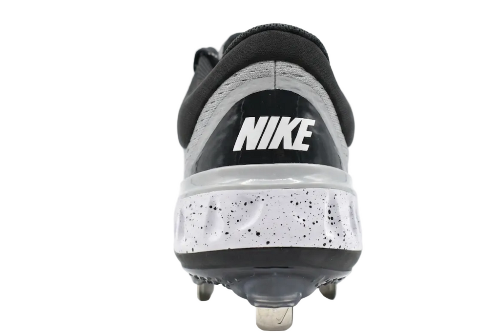 Rear view of the Wolf Grey Alpha Huarache Elite 4 Low featuring the Nike React foam midsole and heel support.