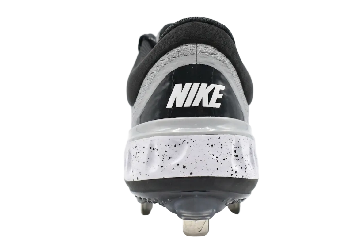 Rear view of the Wolf Grey Alpha Huarache Elite 4 Low featuring the Nike React foam midsole and heel support.