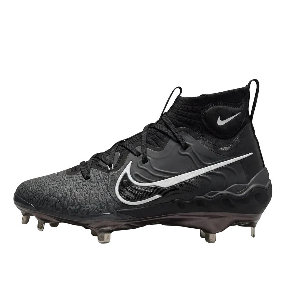 ide profile of Nike Alpha Huarache NXT baseball cleats in Black and Dark Smoke Grey with metal spikes DJ6517-010