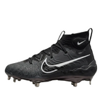 ide profile of Nike Alpha Huarache NXT baseball cleats in Black and Dark Smoke Grey with metal spikes DJ6517-010