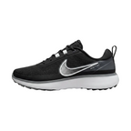 Side profile view of Nike Infinity Ace Next Nature Black White golf shoes showing the classic white Swoosh and lean design, DX0024-010.
