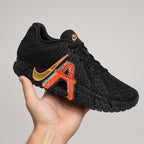 Lateral side view of Nike Ja 3 NY vs NY basketball shoe SKU IM0464-001 showing Swoosh design shown on hand