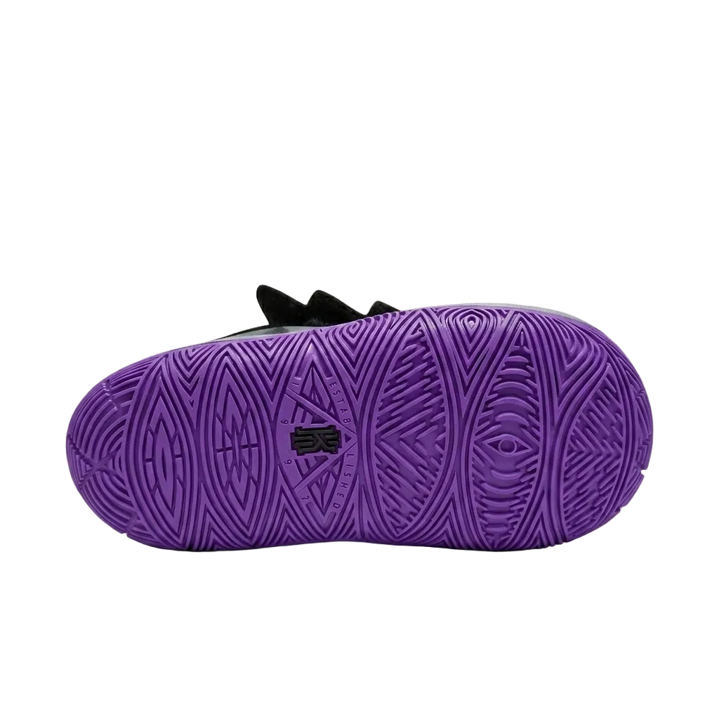 Bottom outsole traction pattern view of toddler Nike Kyrie 5 Graffiti sneakers showing purple rubber grip circles.