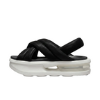 Side profile view of Nike Air Max Isla chunky slip-on sandals highlighting the thick crossover padded strap design, FJ5929-002.